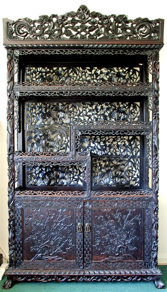 A Chinese black lacquered rosewood cabinet, late 19th century, W.3ft 9in. H.7ft D.1ft 5in.